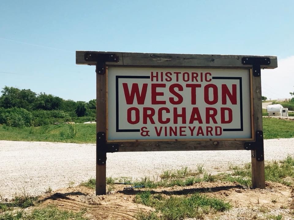 The Historic Weston Orchard and Vineyard sign at the farm entrance