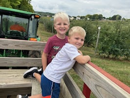 A hayrack ride through the orchard rows at Historic Weston Orchard