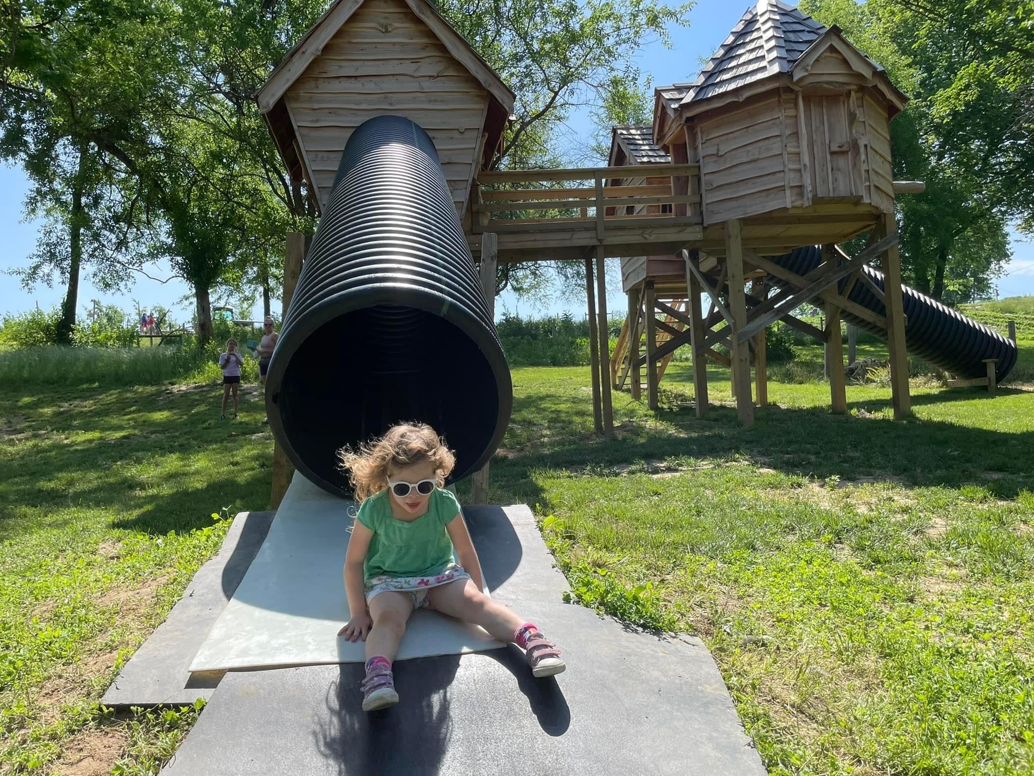 The treehouse village and tube slide at Historic Weston Orchard