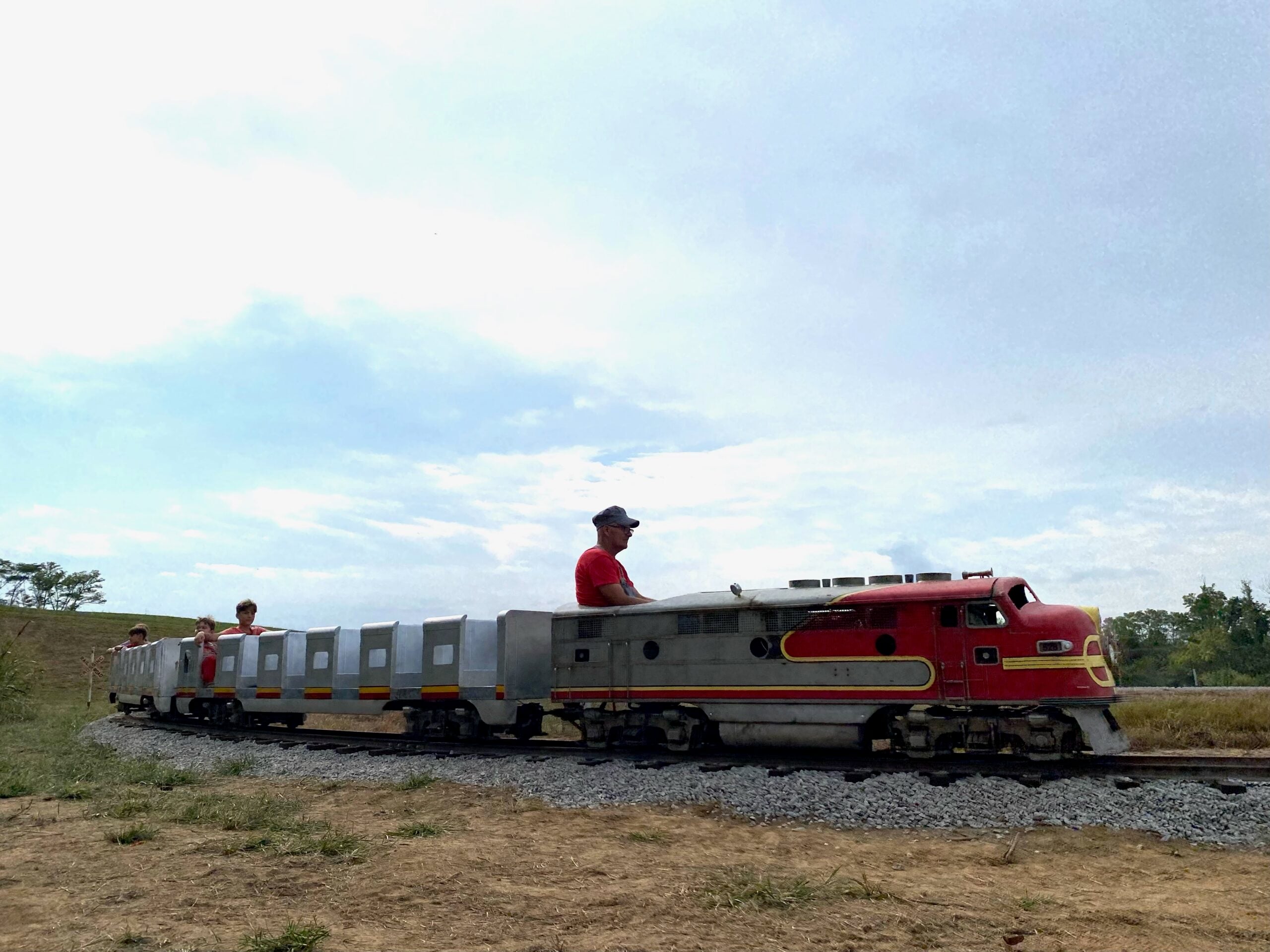 The grain train carrying kids around Historic Weston Orchard on a fall weekend